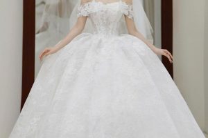 Cô dâu xinh đẹp diện váy cưới trắng lộng lẫy trong studio.